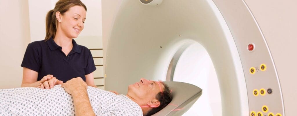 Technician with patient getting CAT scan